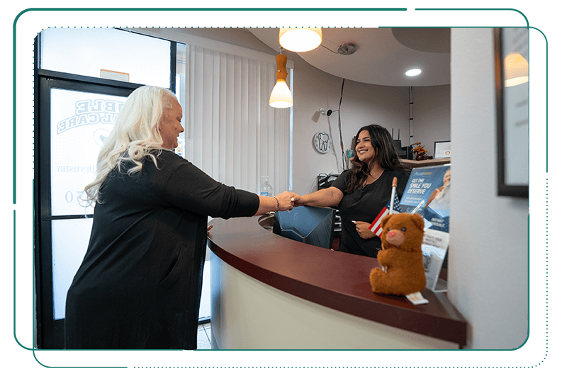 patient being greeted into Noble Dental Care